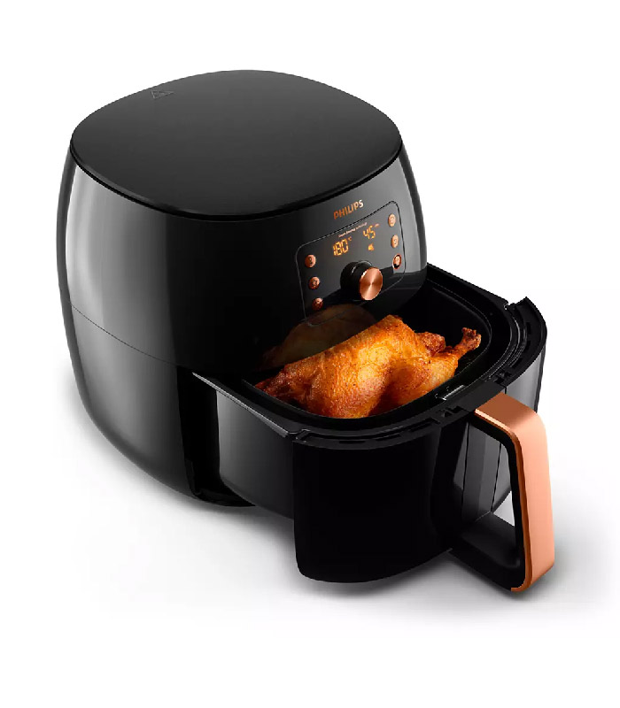 XXL capacity,cooks a whole chicken or 1.4kg of fries -Yes, you can cook family-size meals in the new Airfryer XXL. It's full-size capacity makes cooking a large, delicious meal easy. You can cook a whole chicken or even up to 1.4 kg of fries to satisfy hungry family or friends. Cook up to six portions with the large 7.3L capacity basket. Versatile: Fry. Bake. Grill. Roast. And even reheat! -You can make hundreds of dishes in your Airfryer XXL. Fry, bake, grill, roast and even reheat your meals. Every bite is as delicious as the last thanks to Philips Air flow and the starfish design. It cooks food uniformly from all sides for perfect meals every time. Smart Sensing technology -The new generation of Philips Airfryer does the thinking for you. Enjoy perfect results in two easy steps. Choose a food type and press the button to cook. Smart sensor automatically adjusts the time and temperature for effortless perfect results. Every time! Smart Chef programs for popular dishes -Our professional chefs designed the Smart Chef programs to do the thinking and cooking for you. Fresh or frozen fries, drumsticks or a whole chicken and even a whole fish-with just one touch, your Airfryer XXL will do the thinking and cooking for you. Convenient "Save your favorite" cooking setting -You can save your favorite dish and it will make it just the way you like, every time. And at the touch of one button. The favorite mode will cook your meal for the perfect time and temperature for ultimate convenience. Whether it's a delicious hot breakfast or favorite family recipe, it's perfect every time. The original Airfryer with 7 times faster airflow* -Enjoy healthier fried food that’s crispy on the outside and tender on the inside with up to 90% less fat*. The Philips Airfryer XXL uses hot air (instead of oil) to fry food with little to no added oil. Philips Rapid Air creates 7x faster airflow so that you can enjoy crispier results* and delicious taste. Specifications: Accessories- Included: Recipe booklet, Country of origin- Made in: China General specifications- Product features: Automatic shut-off, -Cool wall exterior -Dishwasher safe -On/off switch -Ready signal -Temperature control -Power-on light -Quickclean -Cancel button -Integrated cord storage -LED display -Patented Rapid Air -Preset cooking function -Time control -Prefix programs: 5 -Keep warm function: 30 min Service- -2-year worldwide guarantee: Yes Sustainability- Packaging: -90% recycled materials -User manual: -100% recycled paper Technical specifications- -Cord length: 0.8  m -Power: 2200-2225  W -Voltage: 220-240  V -Frequency: 50/60  Hz Weight and dimensions- Dimensions of product (LxWxH): 433.10x321.60x315.70  mm Weight of product: 7.99  kg Design and finishing- -Color of control panel: Black -Color(s): Deep black with copper -Material of main body: Plastic Warranty: (Held by Manufacturer)